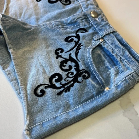 Material Girl light wash jean shorts with black velvet embellishments. Size 7 - Picture 2 of 9